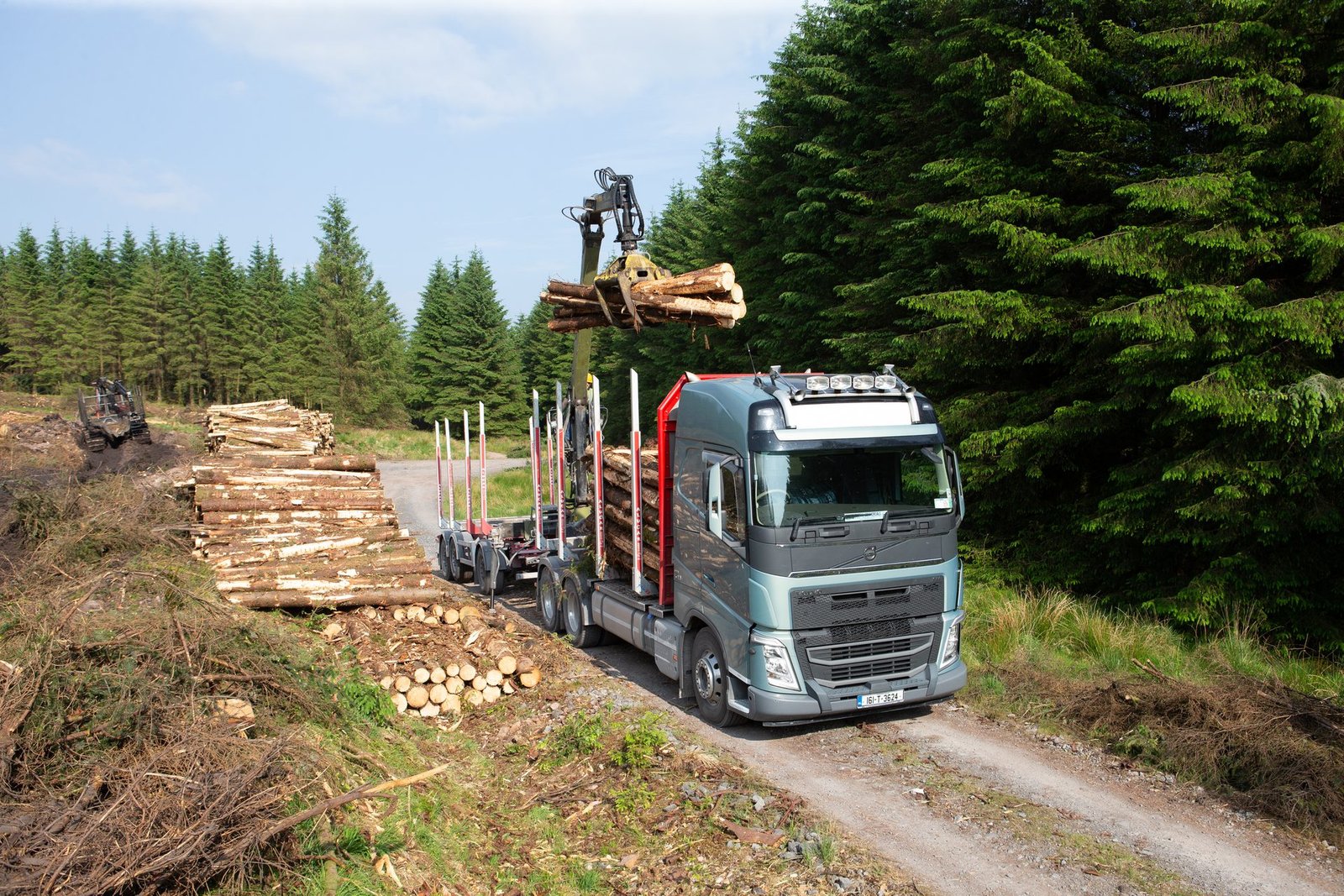 Timber truck loaded with logs on a forestry road