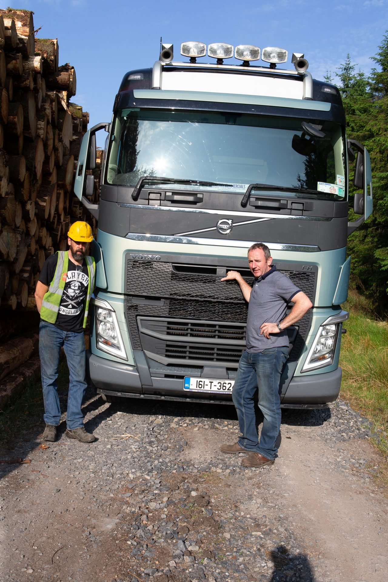Red timber truck on a forest road