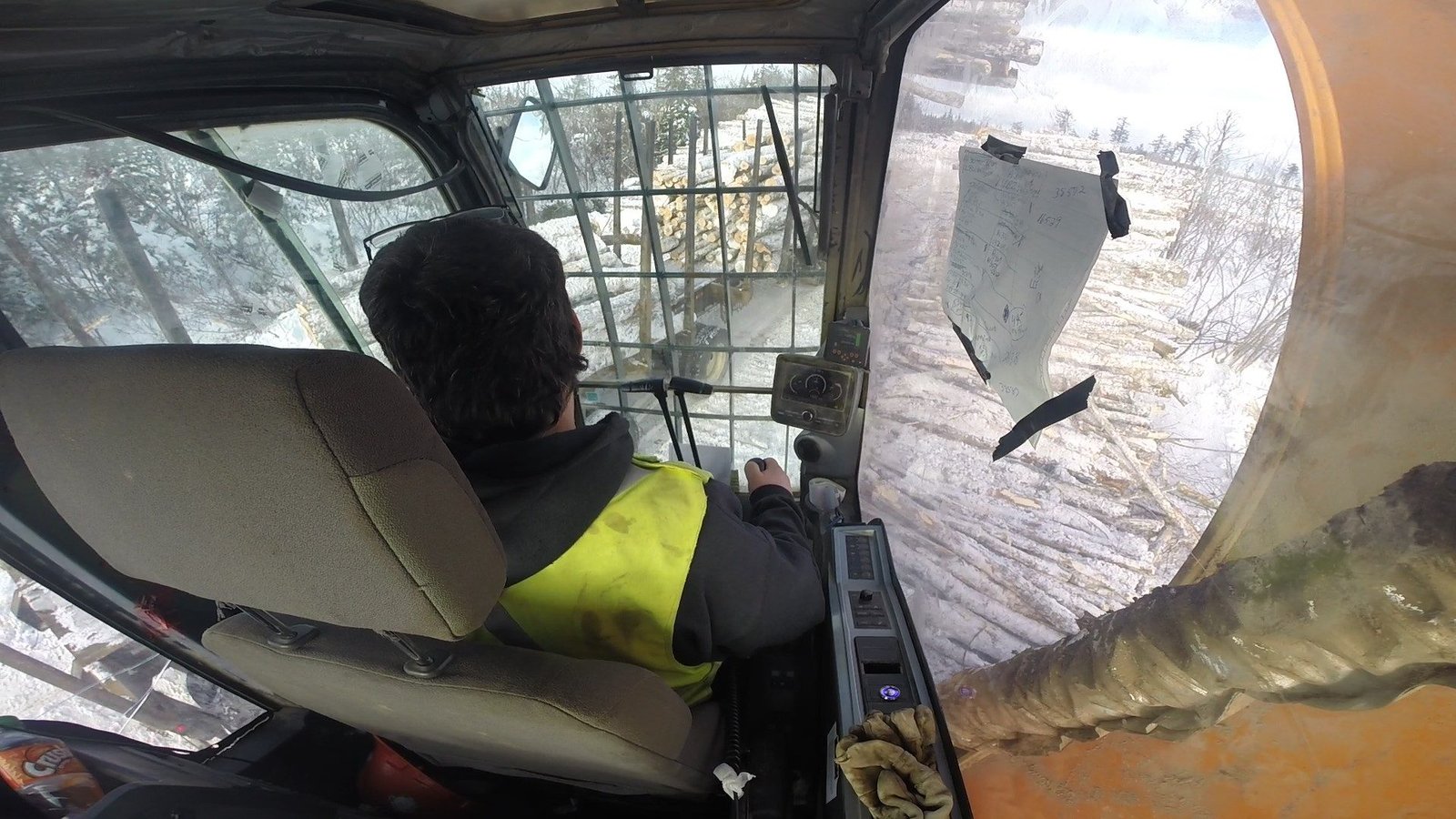 Operator running a forestry crane from the cab